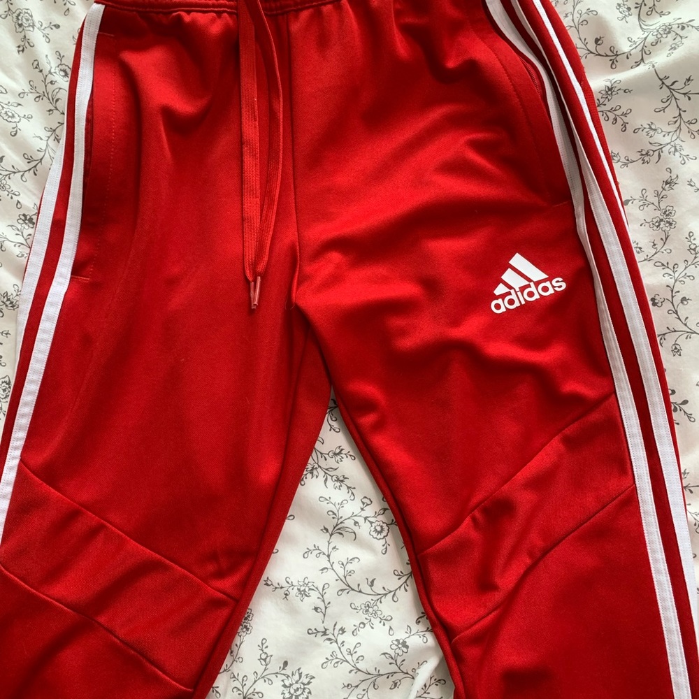 Red track pants